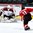 GRAND FORKS, NORTH DAKOTA - APRIL 14: Latvia's Gustavs Grigals #29 makes a save against Switzerland's Dominik Volejnicek #11 in the third period during preliminary round action at the 2016 IIHF Ice Hockey U18 World Championship. (Photo by Matt Zambonin/HHOF-IIHF Images)

